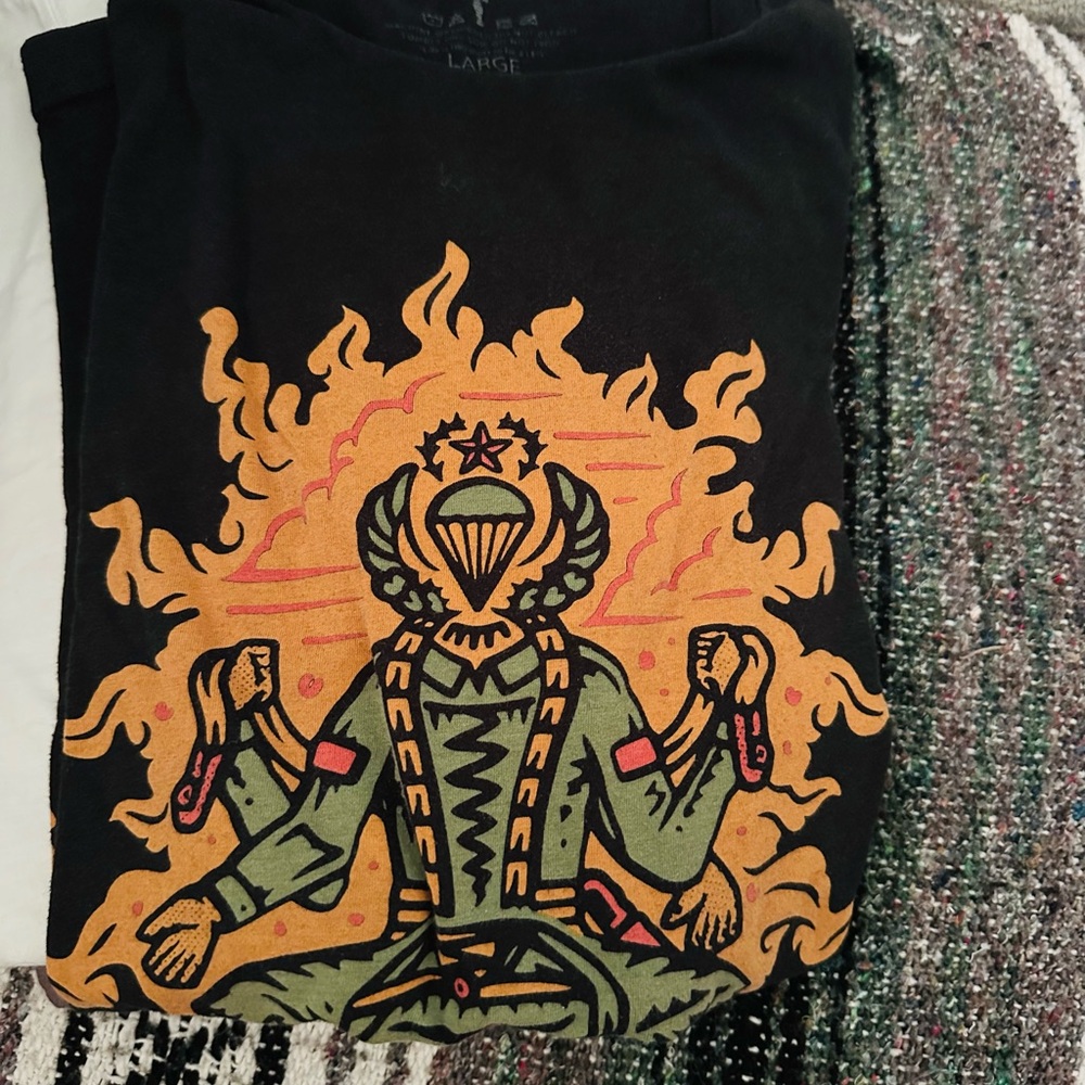 Vintage Black Graphic Tee with Orange and Green Design